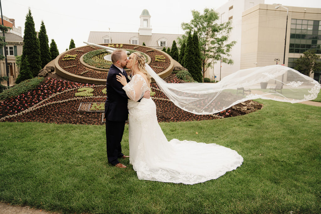 bride and groom portraits with vail toss