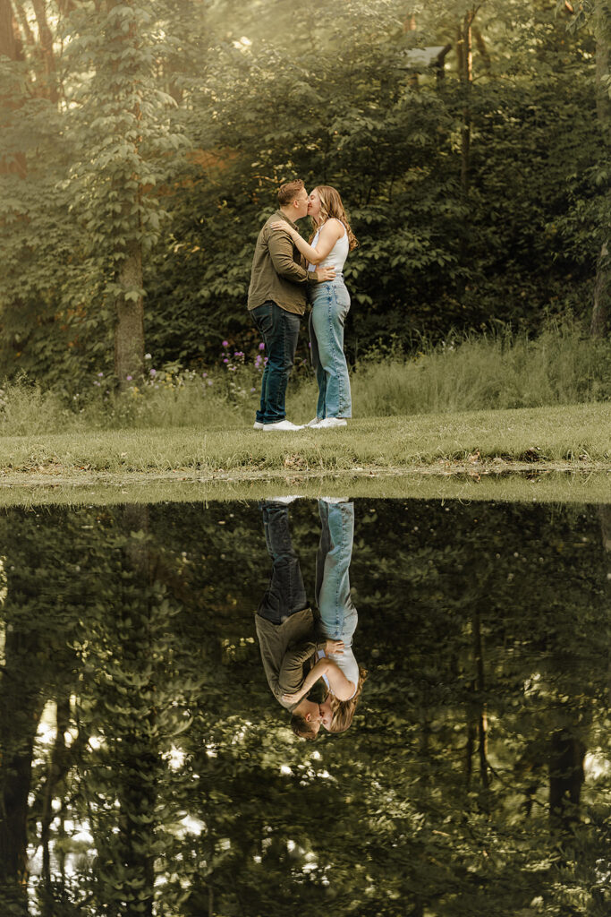 couple reflection in pond