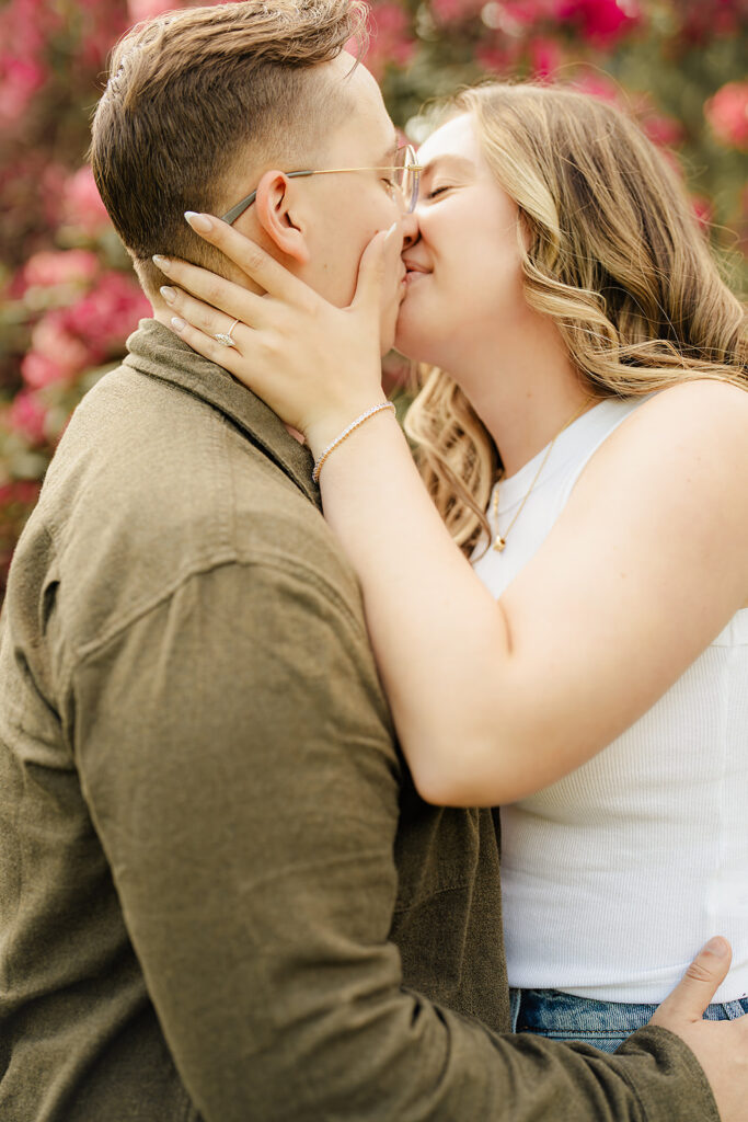 engaged couple kissing