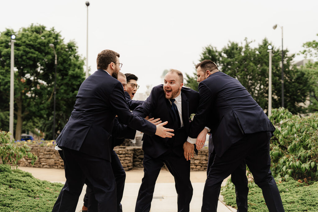 groomsman's hyping the groom group photo
