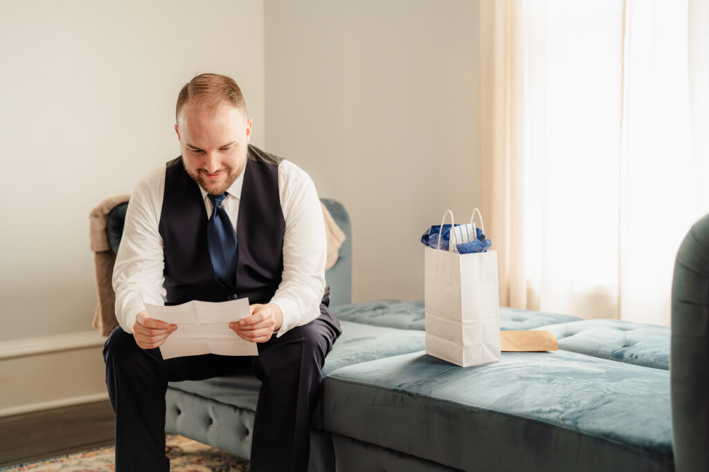 Groom reading letter from bride