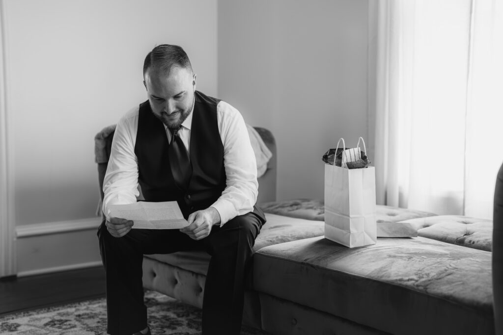 Groom reading letter from bride