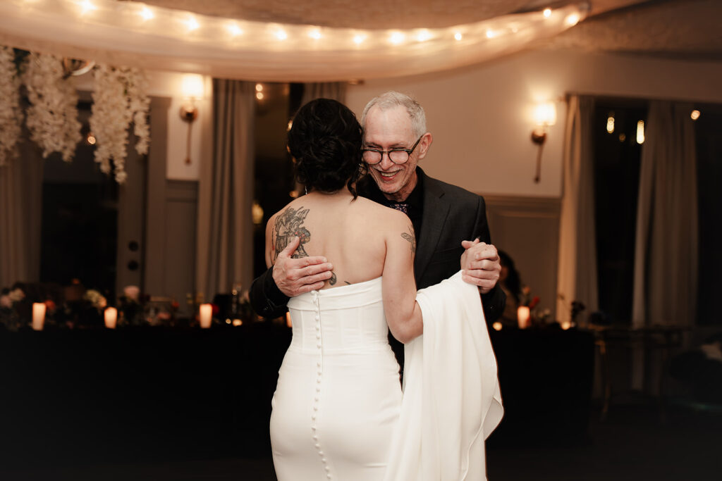 portrait of bride and father dance 