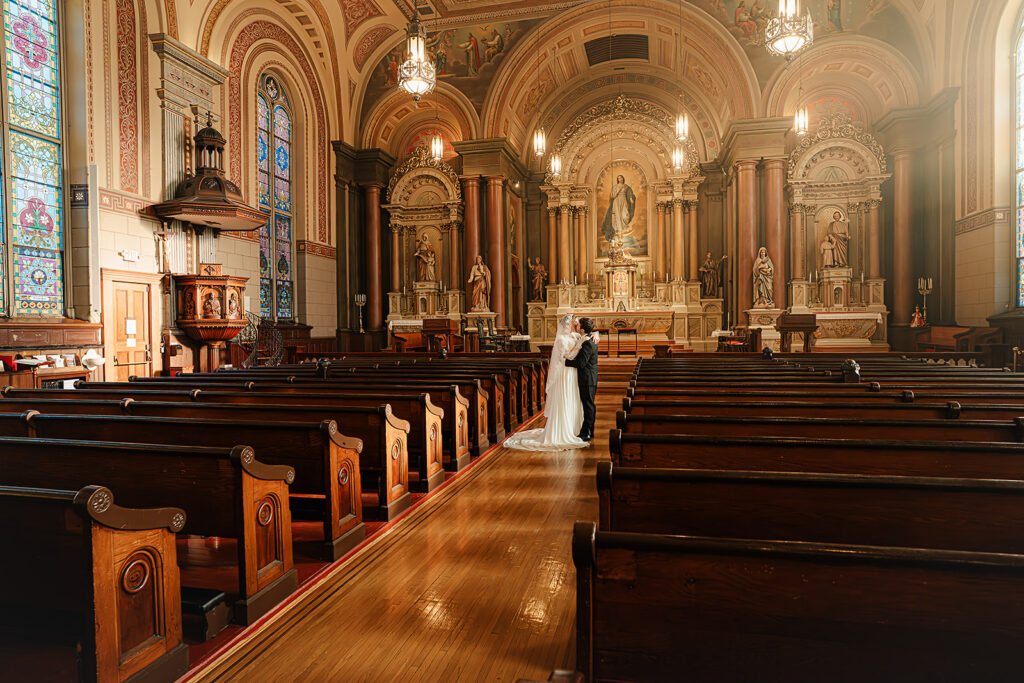 Portrait of bride and groom inside St. Mary's Catholic Church 