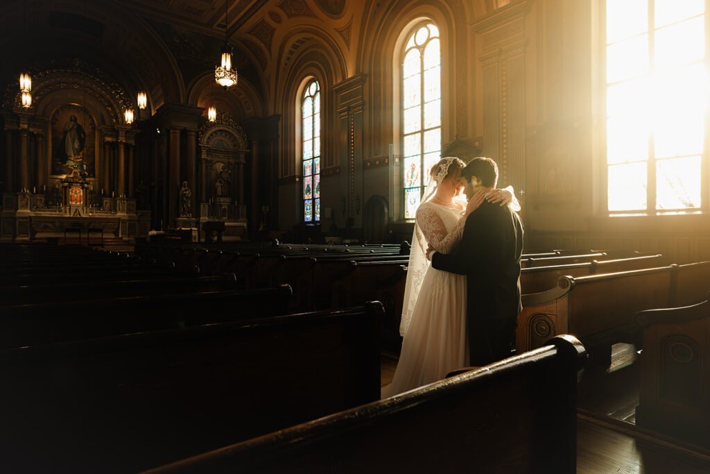 Portrait of bride and groom inside St. Mary's Catholic Church 