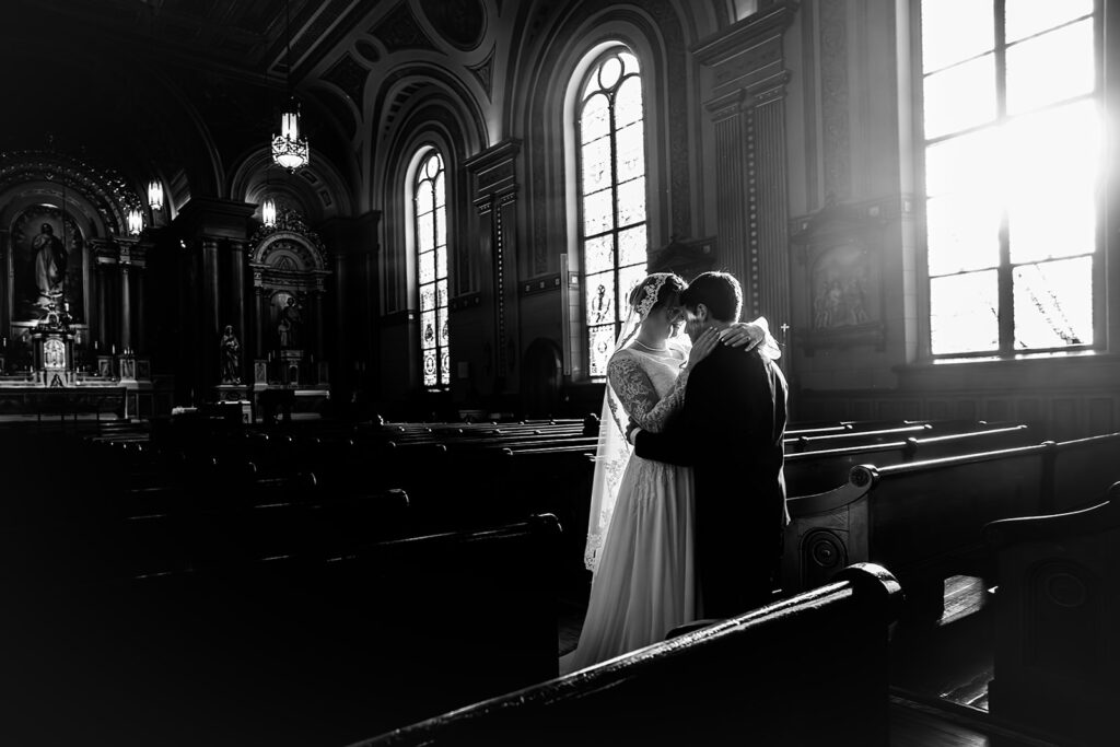 Portrait of bride and groom inside St. Mary's Catholic Church 
