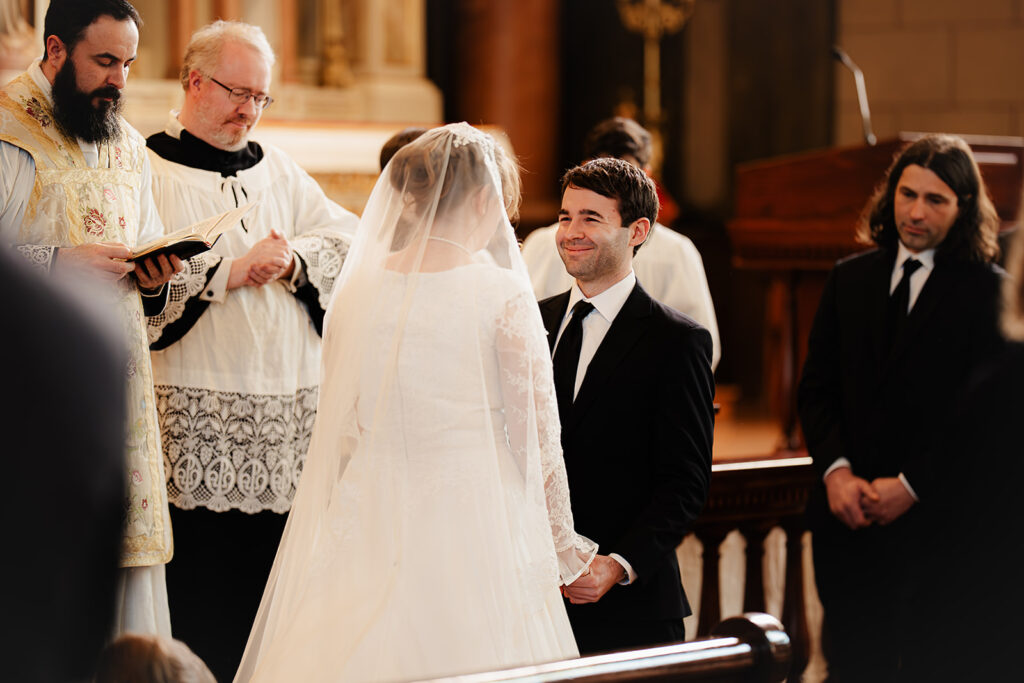 Bride and groom during latin mass