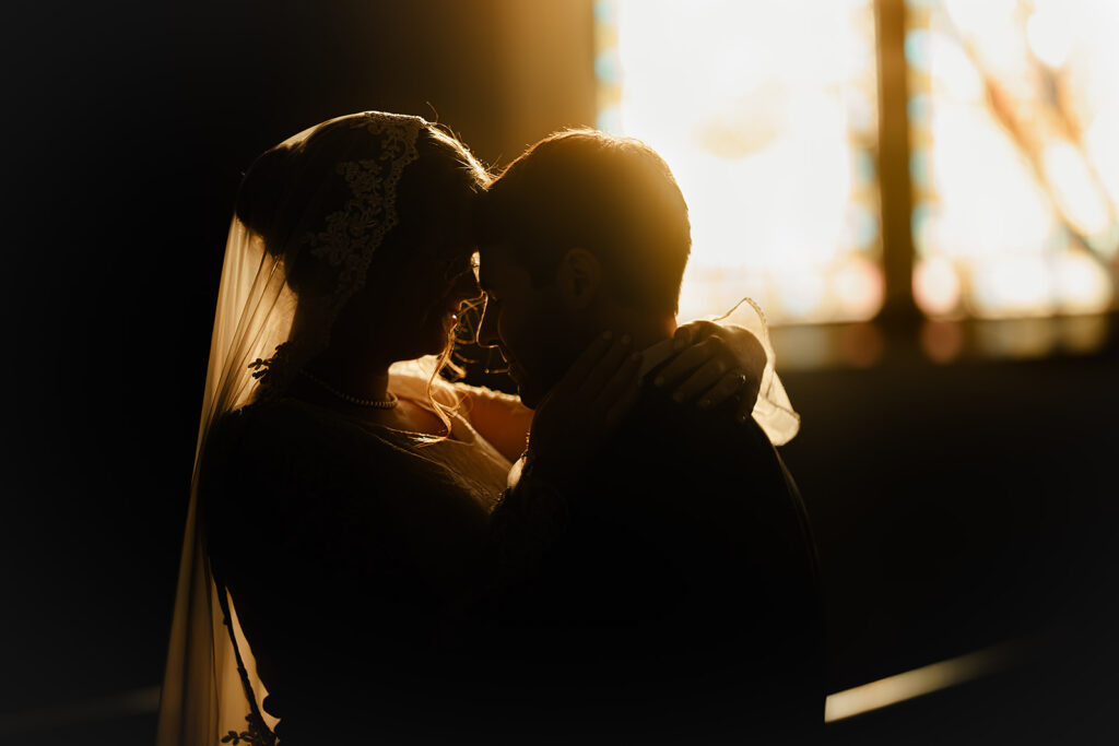 Portrait of bride and groom inside St. Mary's Catholic Church 