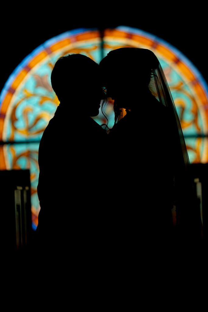 Portrait of bride and groom inside St. Mary's Catholic Church 