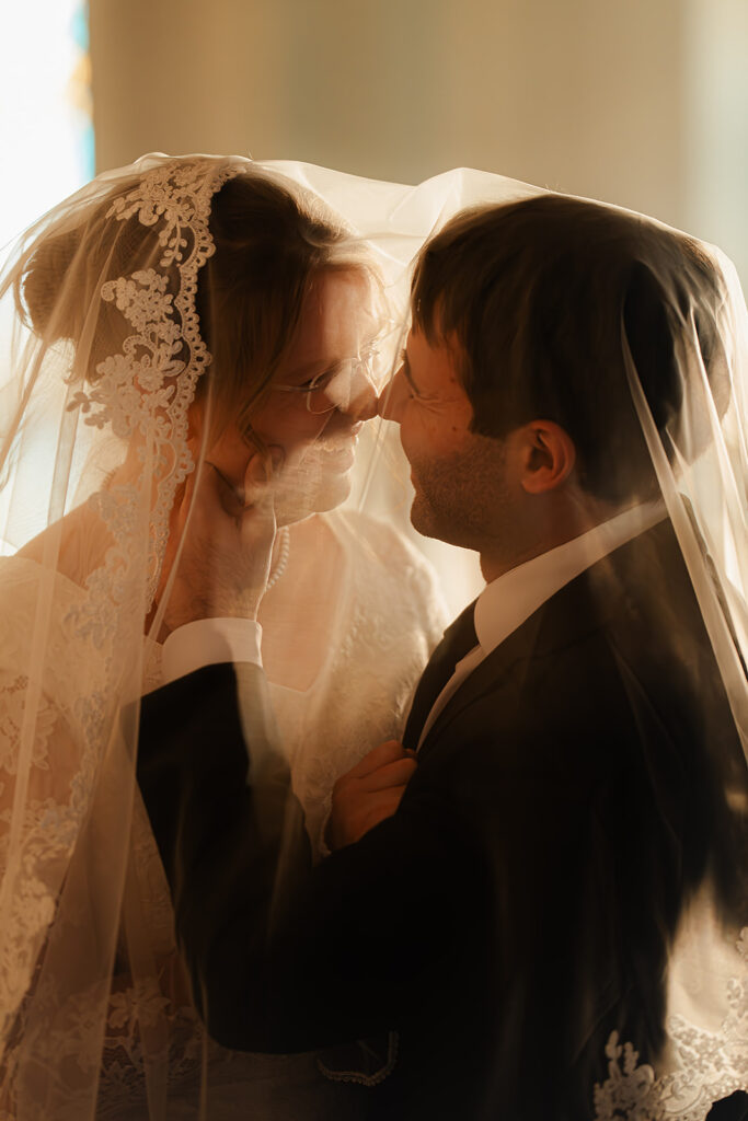 Portrait of bride and groom inside St. Mary's Catholic Church 